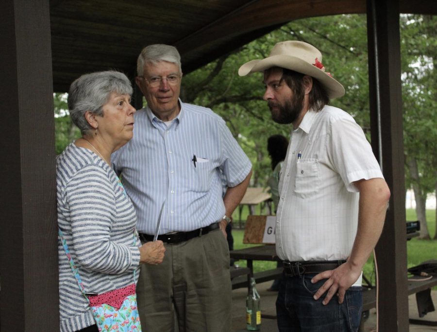 Johnson County residents Tom and Joan Cook speak to Johnson County Supervisor Candidate Jon Green at Greens campaign rally on May 22.