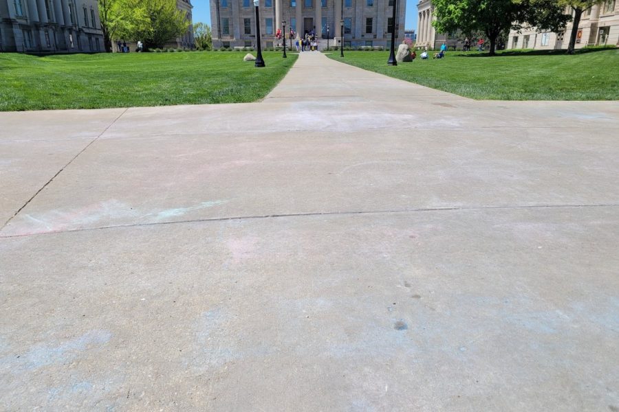 Residue of erased chalk messages left by the UI College Republicans are seen on Friday, May 7.
