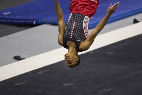 Nebraska all-around Sam Phillips performs his floor routine during the Iowa v. Nebraska men’s gymnastics meet in Carver-Hawkeye Arena on Saturday, March 20, 2021. Iowa defeated Nebraska with a score of 406.700 - 406.650. Phillips tied for first with Iowa’s Bennet Huang on the floor with a score of 14.300.