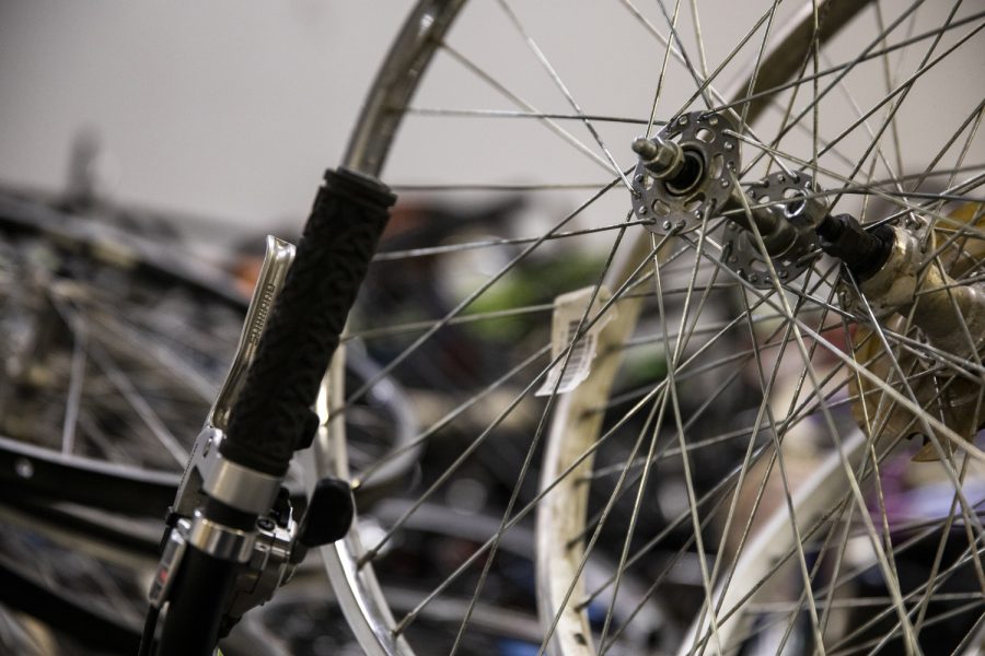 Bikes and spare parts sit in the back room at the new Bike Library Gilbert St. location in Iowa City on Monday, Feb. 22, 2021. Bike Library Inc. is a volunteer-run project in Iowa City that allows community members to check out and buy restored bicycles. 