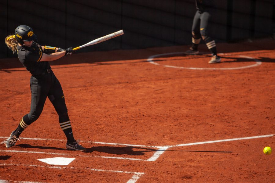 Iowa utility player Denali Loecker hits the ball during a softball game between Iowa and Northwestern at Bob Pearl Softball Field on Saturday, April 17, 2021. The Wildcats defeated the Hawkeyes 9-7. 