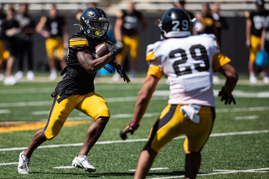 Iowa running back Tyler Goodson carries the ball during a spring practice for Iowa football at Kinnick Stadium on Saturday, May 1, 2021.