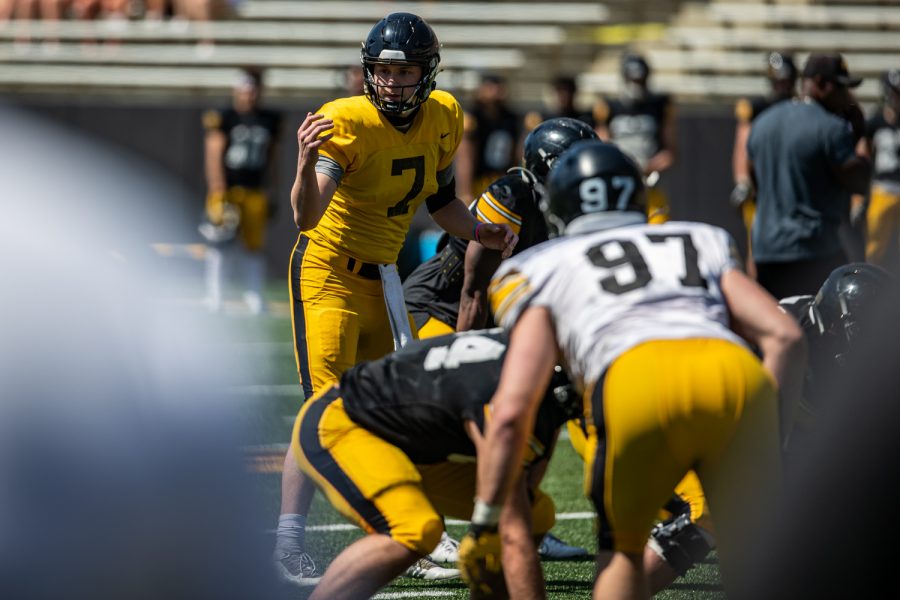 Iowa quarterback Spencer Petras makes an adjustment during a spring practice for Iowa football at Kinnick Stadium on Saturday, May 1, 2021.