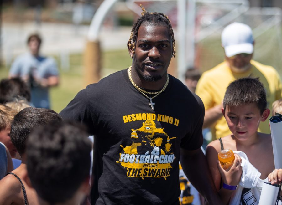 Houston Texans cornerback Desmond King walks with campers during the Desmond King Football Camp at Iowa City High on Saturday, June 19, 2021. 