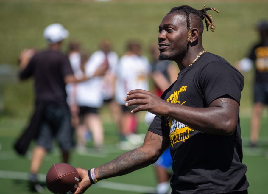 Former Iowa cornerback Desmond King tosses a football during the Desmond King Football Camp on Saturday, June 19, 2021. King currently plays for the Houston Texans. 