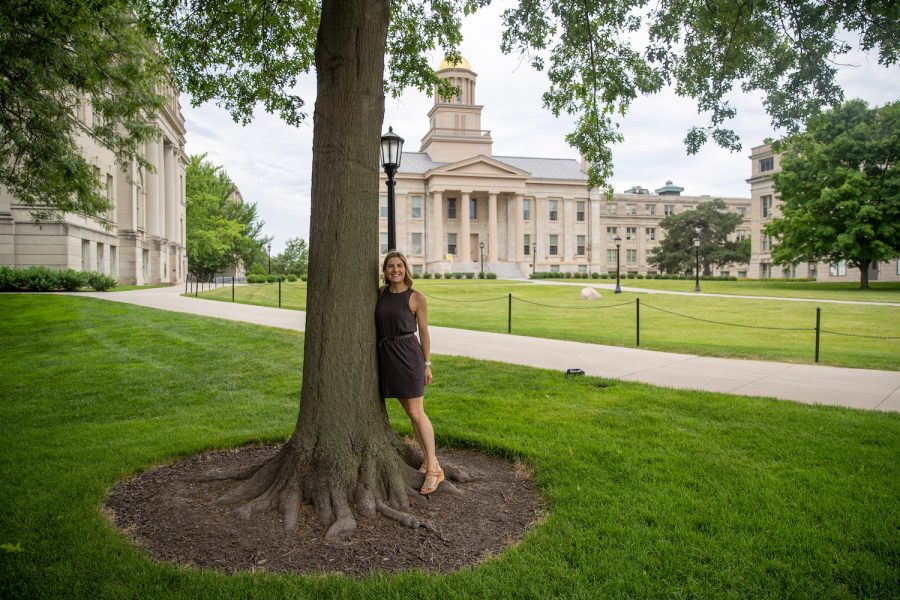University of Iowa lecturer Kirsten E. Kumpf Baele poses next to a tree on Friday, June 18, 2021.