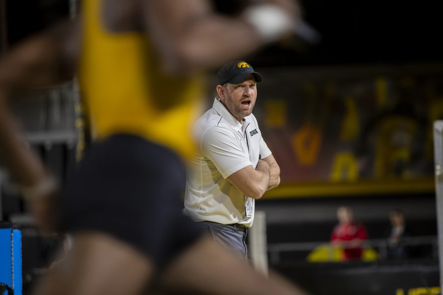 Iowa Director of Track and Field Joey Woody coaches from the infield during the 4x400m relay during the Larry Wieczorek Invitational at the University of Iowa Recreation Building on Jan. 18, 2020.