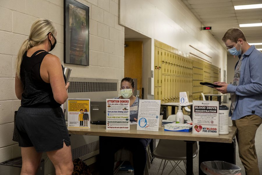 Someone checks in with staff  before donating blood  on Friday, June, 25, 2021. A blood drive was held at the Solon Community Center. The University of Iowa DeGowin Blood Center held the drive.