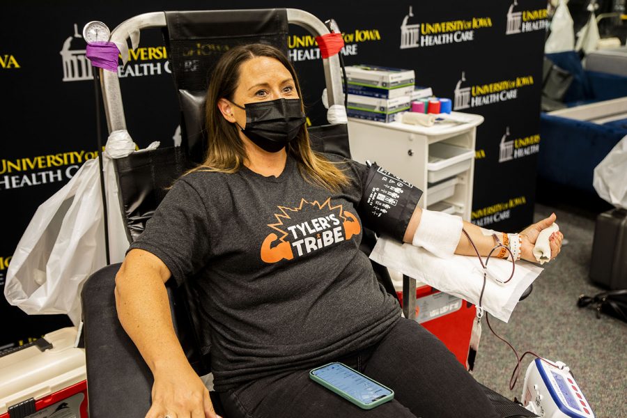 Kari Kuhl donates blood during a drive that was being held for her son Tyler, who is battling cancer.The drive was held by the University of Iowa DeGowin Blood Center on Friday, June 25, 2021. 