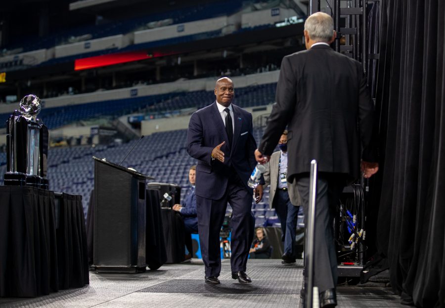 Big Ten commissioner Kevin Warren walks to Kirk Ferentz to shake hands during day two of Big Ten Media Days at Lucas Oil Stadium in Indianapolis, Indiana, on Friday, July 23. 