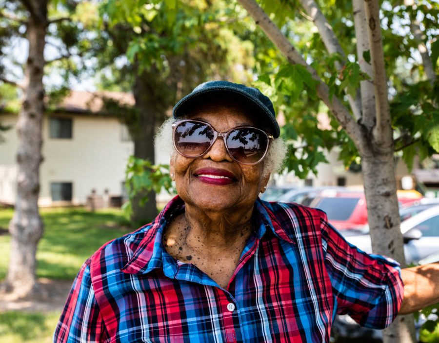 Portia Byrd of Iowa City poses for a portrait while watching the 4th Fest parade on Sunday, July, 4, 2021. This is Byrds 1st 4th Fest parade. Byrd is originally from Florida she moved to Iowa City to be by her son.