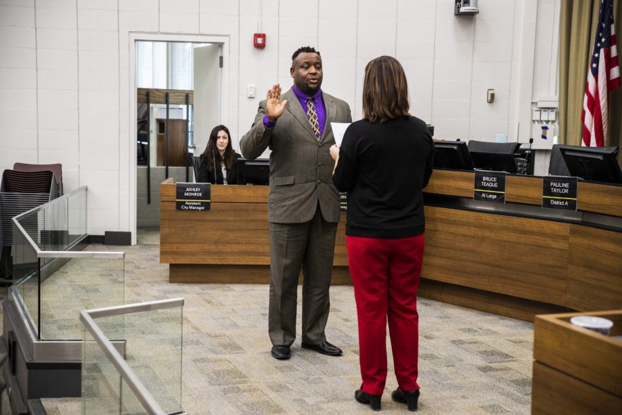 Mayor Bruce Teague is sworn in during the City Council meeting at Iowa City City Hall on Thursday, January 2, 2020. The city councilors also voted on appointments for a number of city commissions. 