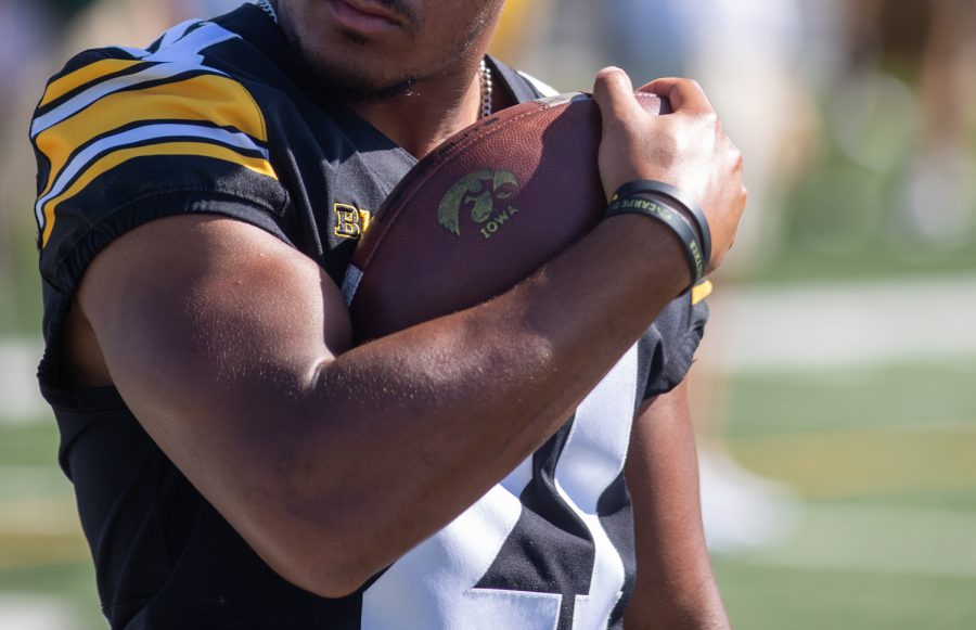 Iowa running back Ivory Kelly-Martin holds onto a football during Iowa football media day at Iowa football’s practice field on Friday, Aug. 13, 2021.