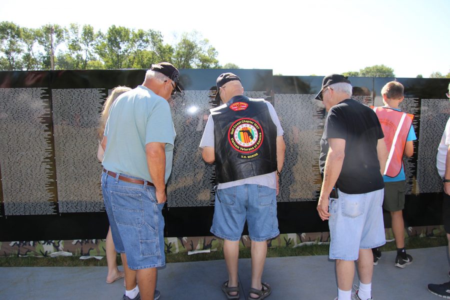 Visitors to the Moving Wall look for family, friends names on Monday, Aug. 16, 2021. The Moving Wall is a half size replica of the Vietnam veterans Memorial in Washington, D.C. There are 58,228 names on the wall.