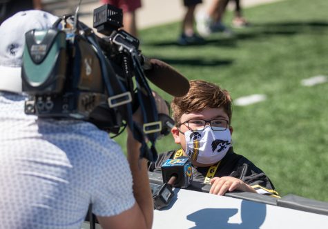 Iowa kid captain Drew Hennigan answers questions during an interview with ABC during “Kid’s Day at Kinnick” inside Kinnick Stadium on Saturday, Aug. 14.