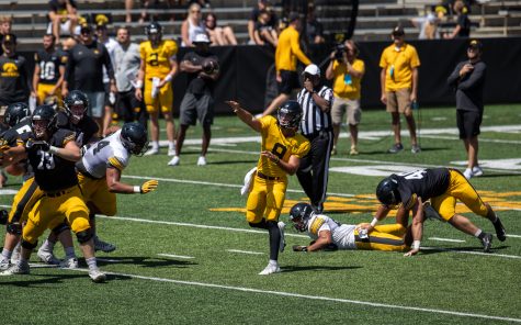 Iowa quarterback Alex Padilla throws the football during “Kid’s Day at Kinnick” inside Kinnick Stadium on Saturday, Aug. 14.