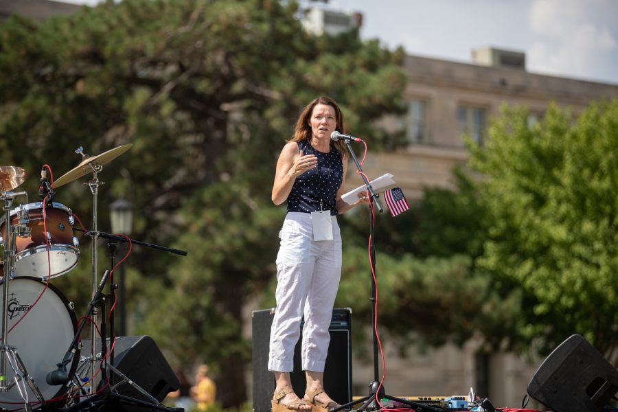 Iowa Rep. Christina Bohannan encourages event-goers to support equal voting rights on stage during a rally for voting rights at the Pentacrest on Saturday, Aug. 28, 2021. 