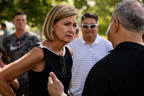 Gov. Kim Reynolds (R-Iowa) listens to people after Ashley Hinson’s BBQ Bash on Saturday, Aug. 28, 2021 at Linn County Fairgrounds. 
