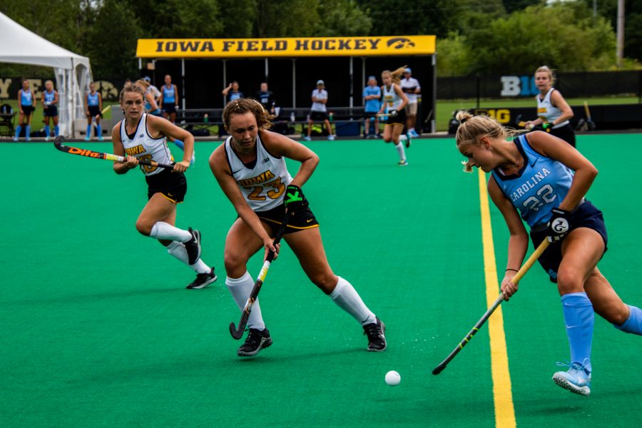 The Iowa Hawkeyes and the North Carolina Tar Heels fight for the ball during the Iowa field hockey game against North Carolina on Sunday, Aug. 29, 2021. The Hawkeyes defeated the Tar Heels 3-1.