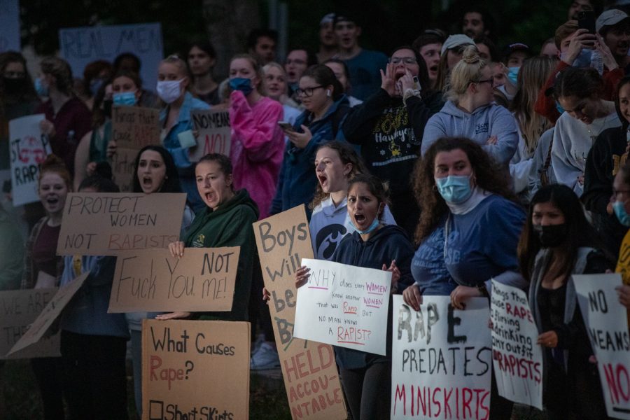 Protesters line up the street during a protest following sexual assault allegations against the University of Iowa’s chapter of Phi Gamma Delta on Tuesday, Aug. 31, 2021.