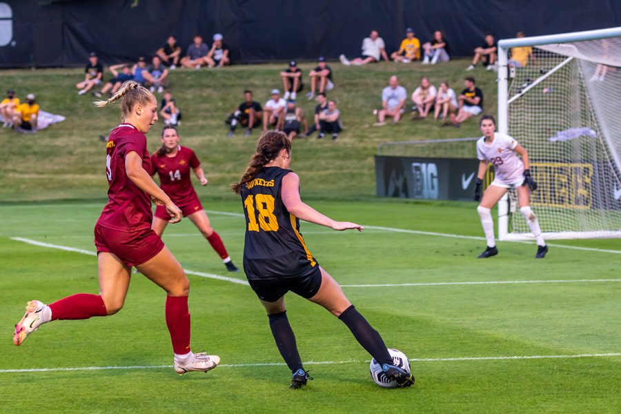Iowa forward Courtney Powell goes to pass the ball to a teammate in an attempt to score a goal during the Iowa Soccer Cy-Hawk Series game against Iowa State on Aug. 26, 2021 at the Iowa Soccer Complex. Iowa defeated Iowa State 2-1. 