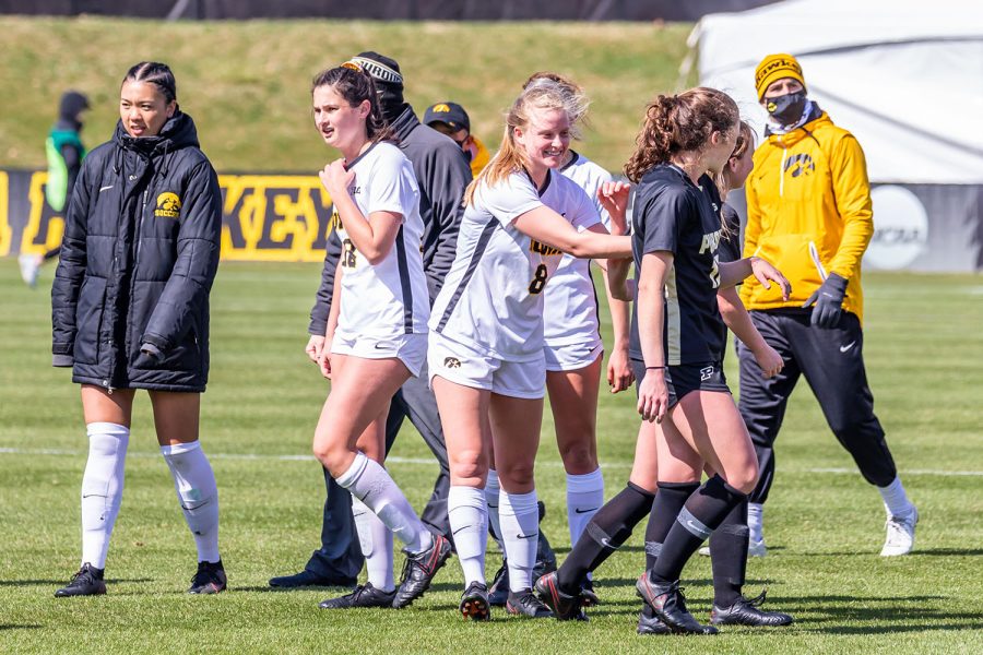 The Iowa Hawkeyes celebrate and congratulate Purdue on a great game at the end of the Iowa Soccer senior day game against Purdue on Mar. 28, 2021 at the Iowa Soccer Complex. Iowa defeated Purdue 1-0. 