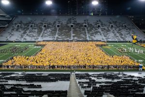 First-year students are seen taking a class of 2025 photo on Kinnick Stadium at Kickoff at Kinnick on Friday, Aug. 20, 2021. 