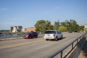 Cars drive across the Iowa Avenue bridge in Iowa City on Monday, Aug. 23, 2021. 