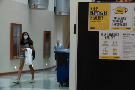 Two students are seen walking in the Seamans Center at the University of Iowa on Aug. 23, 2021. Per the state Board of Regents COVID-19 mask policy, students have the option to wear a mask.