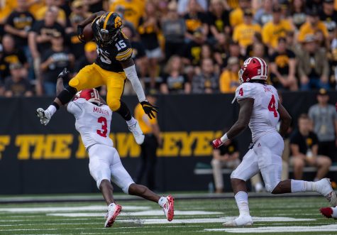 Iowa running back Tyler Goodson hurdles Indiana defensive back Tiawan Mullen during a football game between No. 18 Iowa and No. 17 Indiana at Kinnick Stadium on Saturday, Sept. 4, 2021. The Hawkeyes defeated the Hoosiers 34-6.