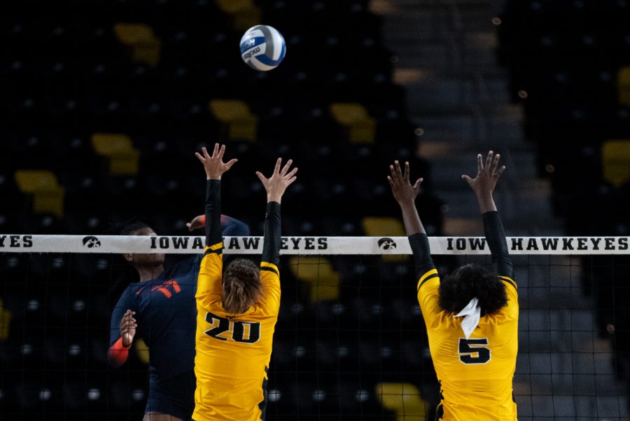 Iowa middle blocker Toyosi Onabanjo and outside hitter Edina Schmidt go up to block a kill at a volleyball game between Iowa and Syracuse at the Xtreme Arena on Thursday, Sept. 9, 2021. Syracuse defeated Iowa 3-1. 