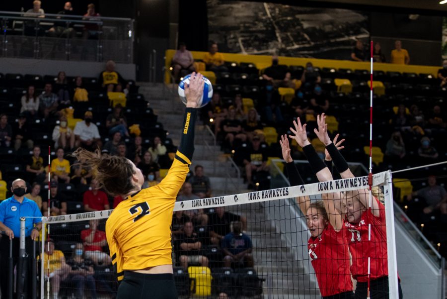 Right+side+Courtney+Buzzerio+goes+for+a+kill+against+two+Ball+State+blockers+during+the+volleyball+match+between+Iowa+and+Ball+State+on+Friday%2C+Sept+10%2C+2021.+The+Cardinals+defeated+the+Hawkeyes+3-2.+