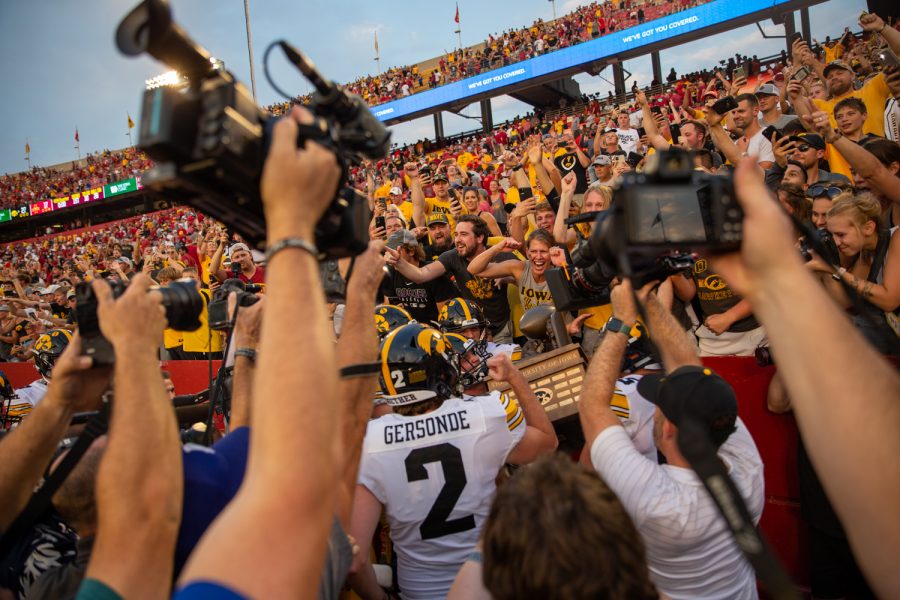 Iowa grabs the Cy-Hawk Trophy during a football game between No. 10 Iowa and No. 9 Iowa State at Jack Trice Stadium in Ames on Saturday, Sept. 11, 2021. The Hawkeyes defeated the Cyclones 27-17. 
