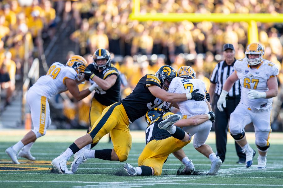 Iowa+defensive+linemen+Zach+VanValkenburg+and+Lukas+Van+Ness+combine+for+a+sack+on+Kent+State+quarterback+Dustin+Crum+during+a+football+game+between+Iowa+and+Kent+State+at+Kinnick+Stadium+on+Saturday%2C+Sept.+18%2C+2021.+The+Hawkeyes+defeated+the+Golden+Flashes+30-7.+