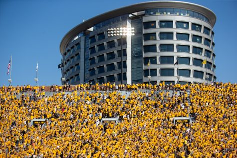 Fans participate in the wave toward the University of Iowa Stead Family Childrens Hospital during a football game between Iowa and Kent State at Kinnick Stadium on Saturday, Sept. 18, 2021. The Hawkeyes defeated the Golden Flashes 30-7. 