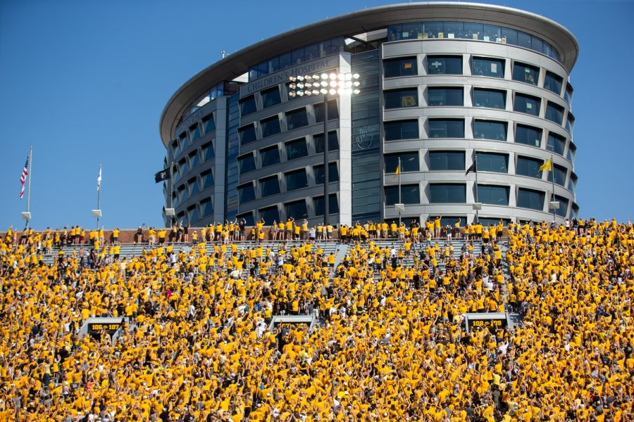 Fans participate in the wave toward the University of Iowa Stead Family Children's Hospital during a football game between Iowa and Kent State at Kinnick Stadium on Saturday, Sept. 18, 2021. The Hawkeyes defeated the Golden Flashes 30-7. 