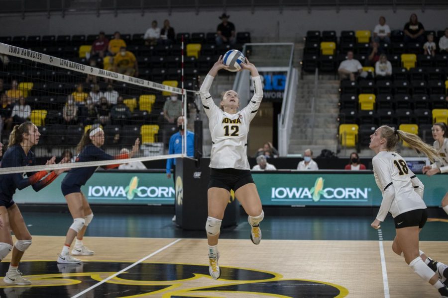Iowa setter Bailey Ortega sets the ball during a volleyball game between Iowa and Illinois at Xtreme Arena in Coralville, Iowa, on Wednesday, Sept. 22, 2021. The Fighting Illini defeated the Hawkeyes with a score of 3-2. 