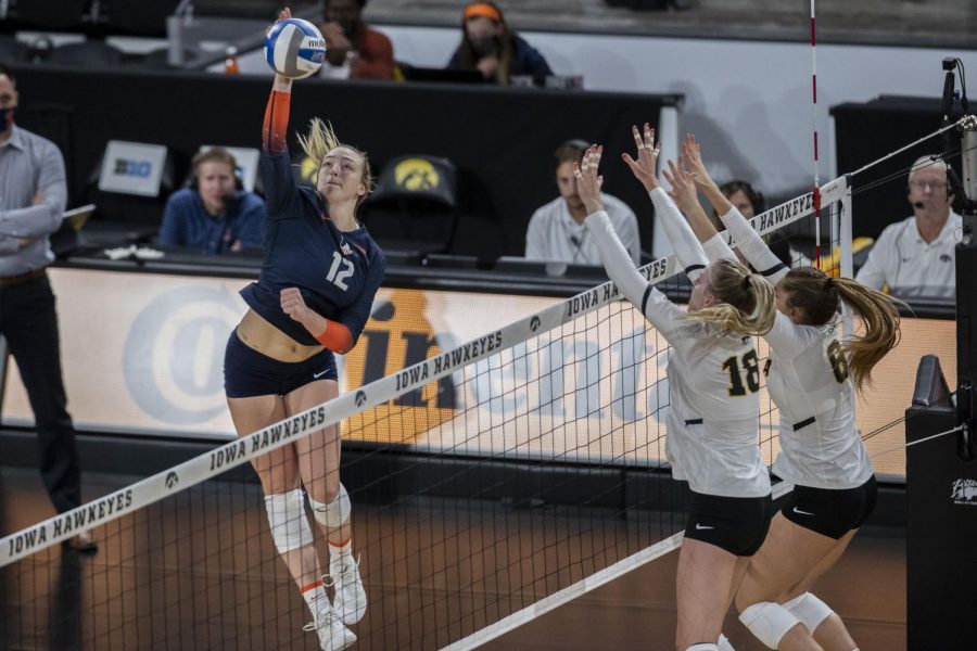 Illinois outside hitter Raina Terry spikes the ball during a volleyball game between Iowa and Illinois at Xtreme Arena in Coralville, Iowa, on Wednesday, Sept. 22, 2021. The Fighting Illini defeated the Hawkeyes with a score of 3-2. 