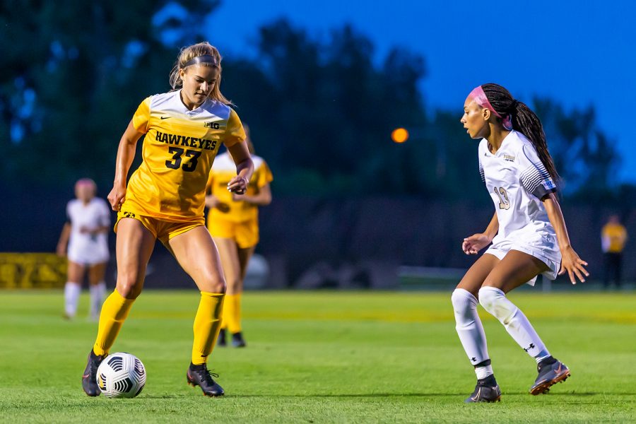 Iowa defender Riley Burns dribbles the ball during the Iowa Soccer game against Purdue-Fort Wayne on Sep. 2, 2021 at the Iowa Soccer Complex. Iowa defeated Purdue-Fort Wayne, 5-0. 