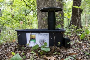 A mosquito trap is seen on Tuesday, Aug. 31, 2021. The trap, placed by Johnson County Public Health Mosquito Surveillance Program, is located just off a trail in Hickory Hill park. The park is located at 1439 E Bloomington St.
