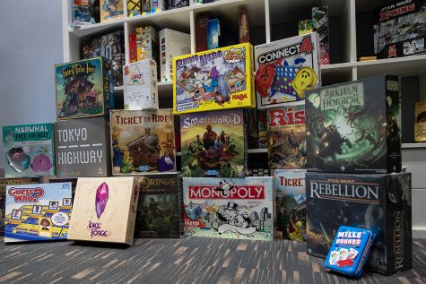 A shelf of board games is shown from the inside of the board cafe, Fortuna in Iowa City on Sept. 29, 2021. 