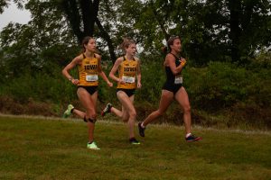 Iowa runners Lauren McMahon (left) and Miriam Sandeen	 (right) compete in the Hawkeye Invite meet at the Ashton Cross Country Course on Friday, Sept. 3, 2021.