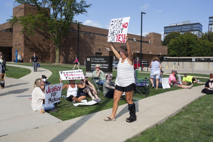 Protesters stood outside the Johnson County Attorney office on Thursday Sept. 9th 2021. The small group of protesters gathered to show support for Makéna after sexual assault allegations against the University of Iowas chapter of Phi Gamma Delta. (Grace Kreber/The Daily Iowan)