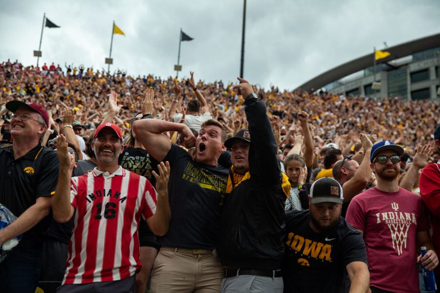 Fans celebrate during a football game between No. 18 Iowa and No. 17 Indiana at Kinnick Stadium on Saturday, Sept. 4, 2021. The Hawkeyes defeated the Hoosiers 34-6. It has been 651 days since fans were allowed into Kinnick.