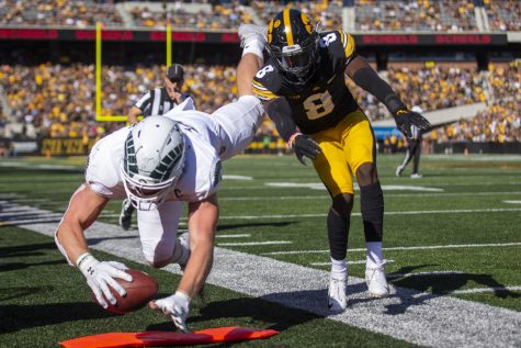 Iowa defensive back Matt Hankins forces Colorado State tight end Trey McBride out of bounds during a football game between Iowa and Colorado State at Kinnick Stadium on Saturday, Sept. 25, 2021. The Hawkeyes defeated the Rams 24-14. (Jerod Ringwald/The Daily Iowan)