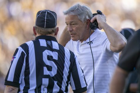 Iowa head coach Kirk Ferentz talks with an official during a football game between Iowa and Colorado State at Kinnick Stadium on Saturday, Sept. 25, 2021. The Hawkeyes defeated the Rams 24-14. 