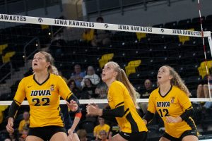 Outside hitter Addie VanderWeide, middle blocker Hannah Clayton and setter Bailey Ortega gets ready for a high ball near the net at the Xtreme Arena on Thursday, Sept. 9, 2021. Syracuse goes on to defeat Iowa 3-1. 