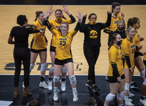 Iowa Setter Bailey Ortega jumps up after a win during a volleyball match between Iowa and Michigan State at Carver-Hawkeye Arena on Saturday, March 27, 2021. The Hawkeyes defeated the Spartans 3-0. 