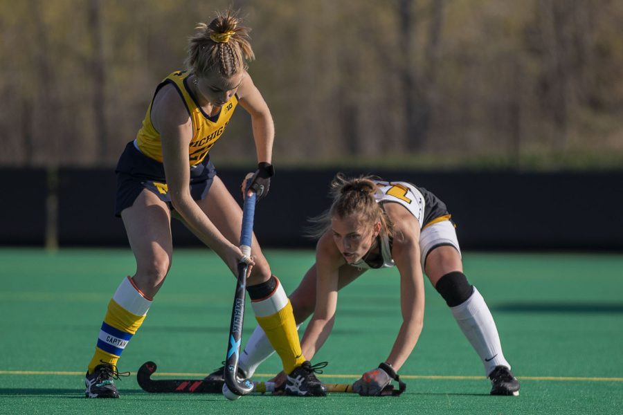 Iowa forward Leah Zellner blocks Michigan fullback Halle ONeil during the fourth quarter of the Big Ten field hockey tournament semifinals between No. 5 Iowa and No. 1 Michigan on Thursday, April 22, 2021 at Grant Field. With five minutes left of the game, Iowa pulled their goalkeeper to replace the position with another player on offense. The Hawkeyes were defeated by the Wolverines, 0-2. Michigan will go on to play against No. 7 Ohio State in the championships on Saturday.