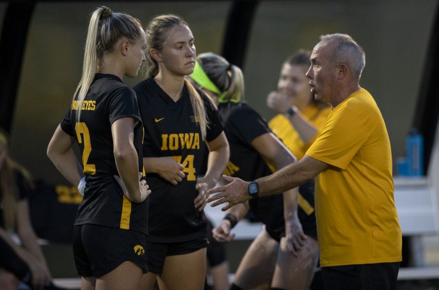Iowa+midfielder+Hailey+Ryderberg+and+defender+Sara+Wheaton+meet+with+head+coach%2C+Dave+Diianni+before+the+game+during+a+soccer+game+between+Iowa+and+Maryland+at+the+UI+Soccer+Complex+on+Sept.+30%2C+2021.+The+Hawkeyes+defeated+the+Terrapins+2-1.